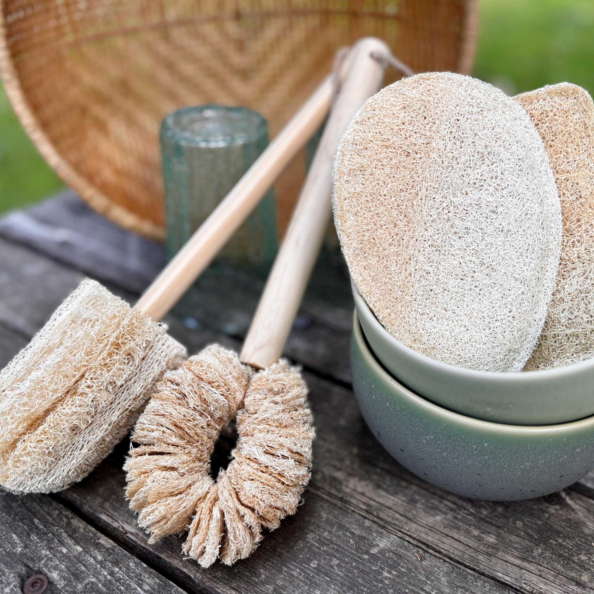 Kitchen collection, mug cleaner, pot scrubber, dish sponge. With bowls, glasses, and a basket